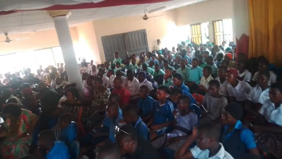 Students from the competing schools fill the hall, 2025