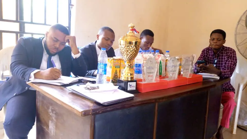 Judges at their table beside the trophies
