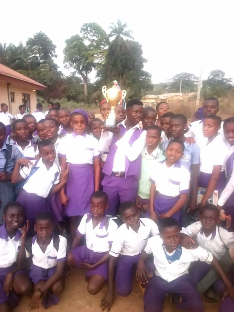 The winning New Haven Model Secondary School students celebrate with the trophy