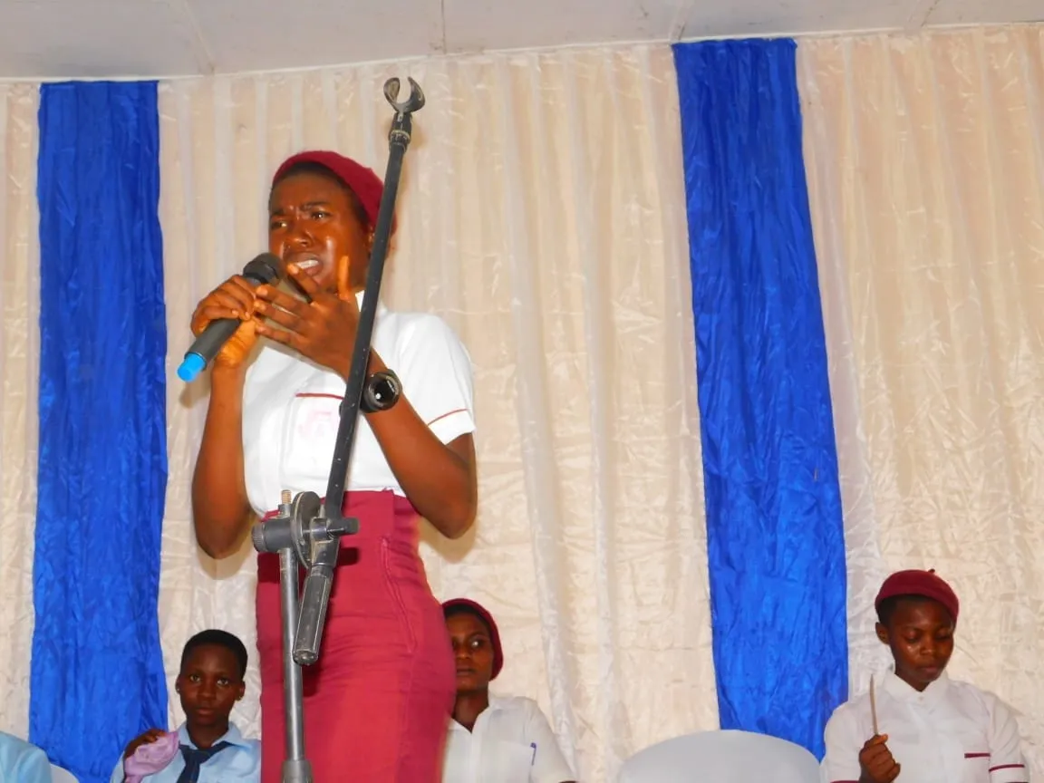 A student argues her case at the microphone during the IT Debate
