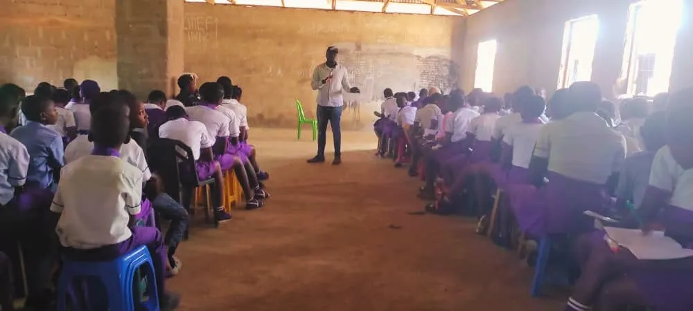 Students listen to a digital skills talk in a school hall