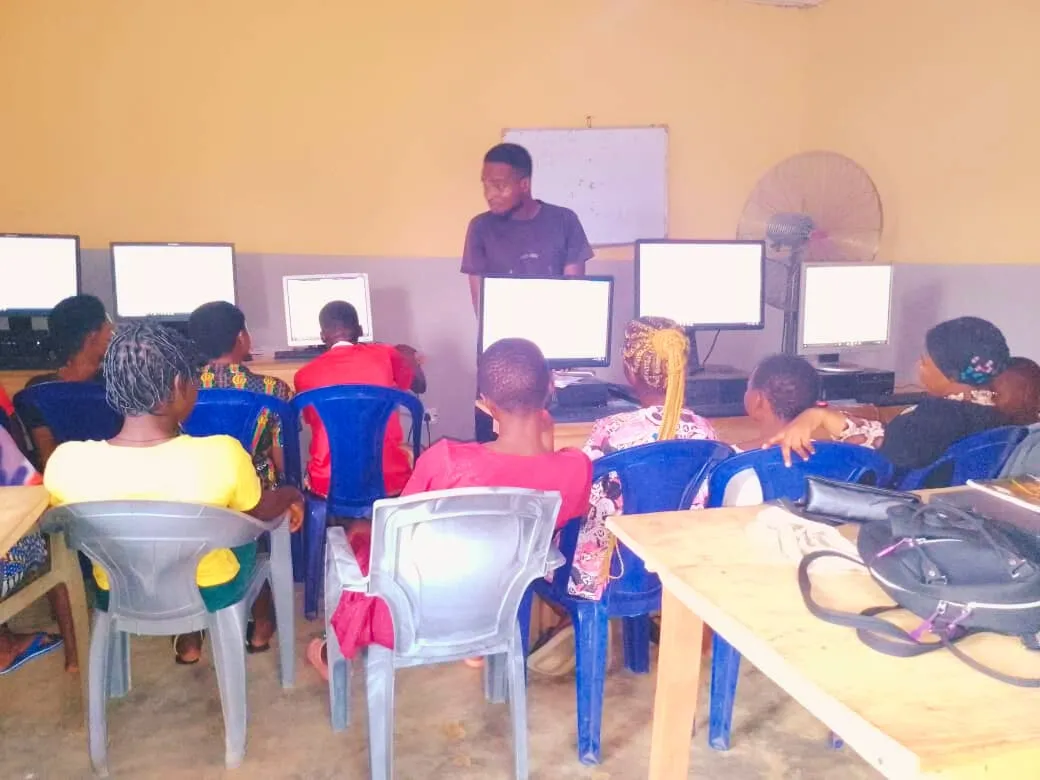 A trainer leads a computer class