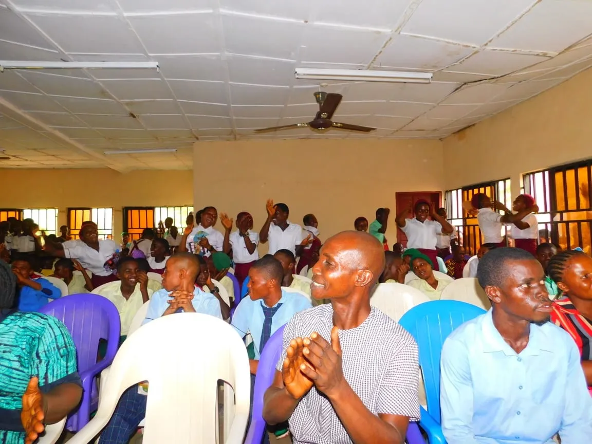 Audience members applaud at the IT Debate