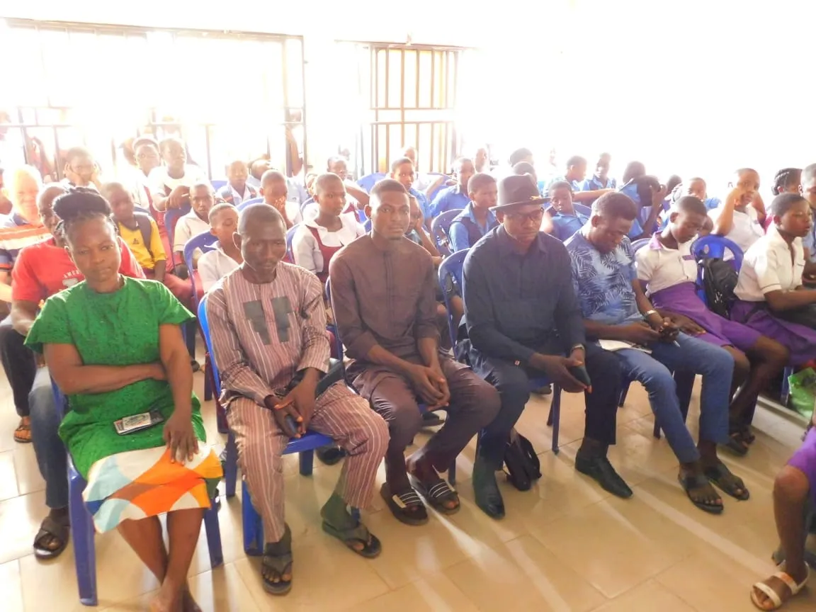 Guests and parents seated at the debate