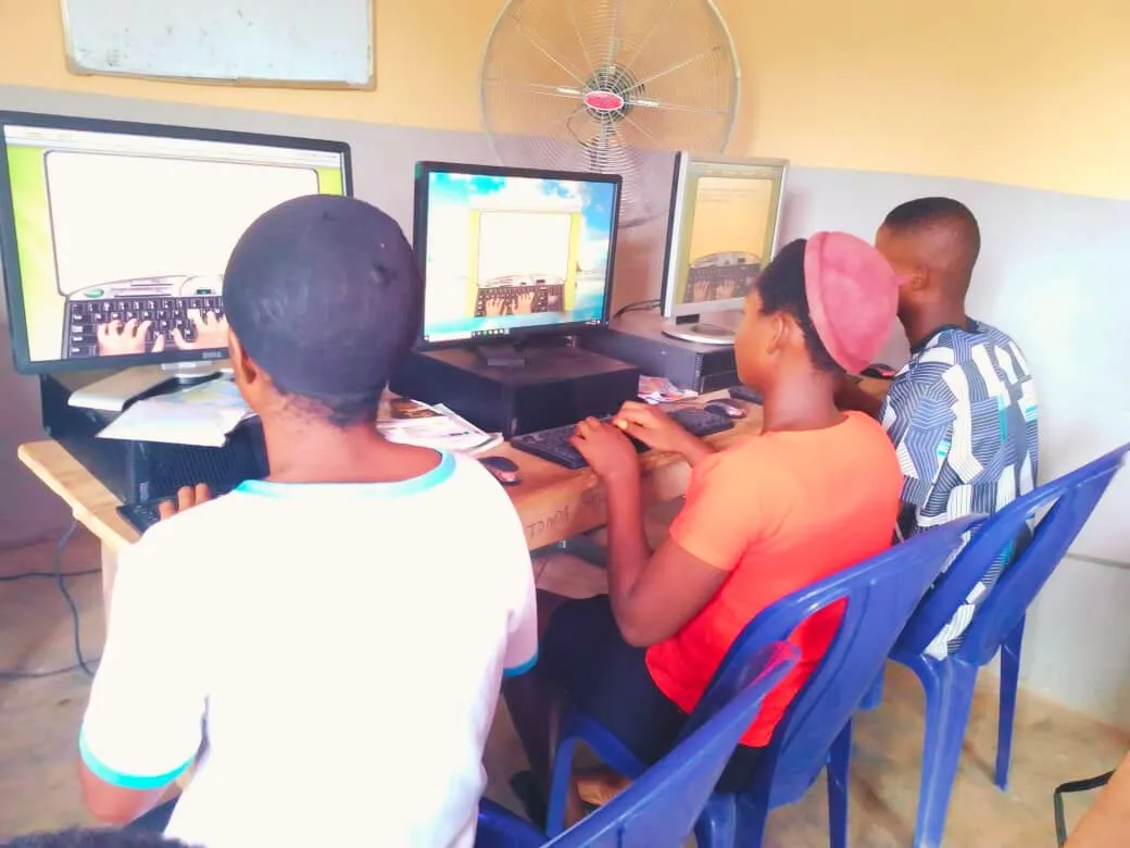 Students work in pairs at computers